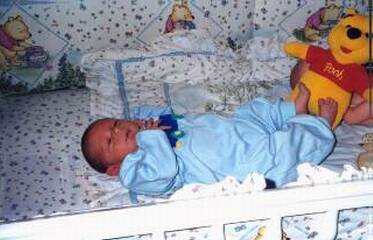 Danny and Pooh in crib